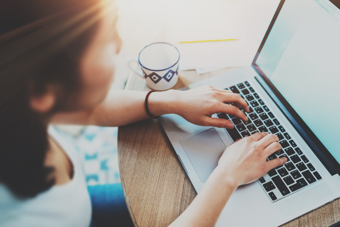 Woman does small business accounting on a laptop