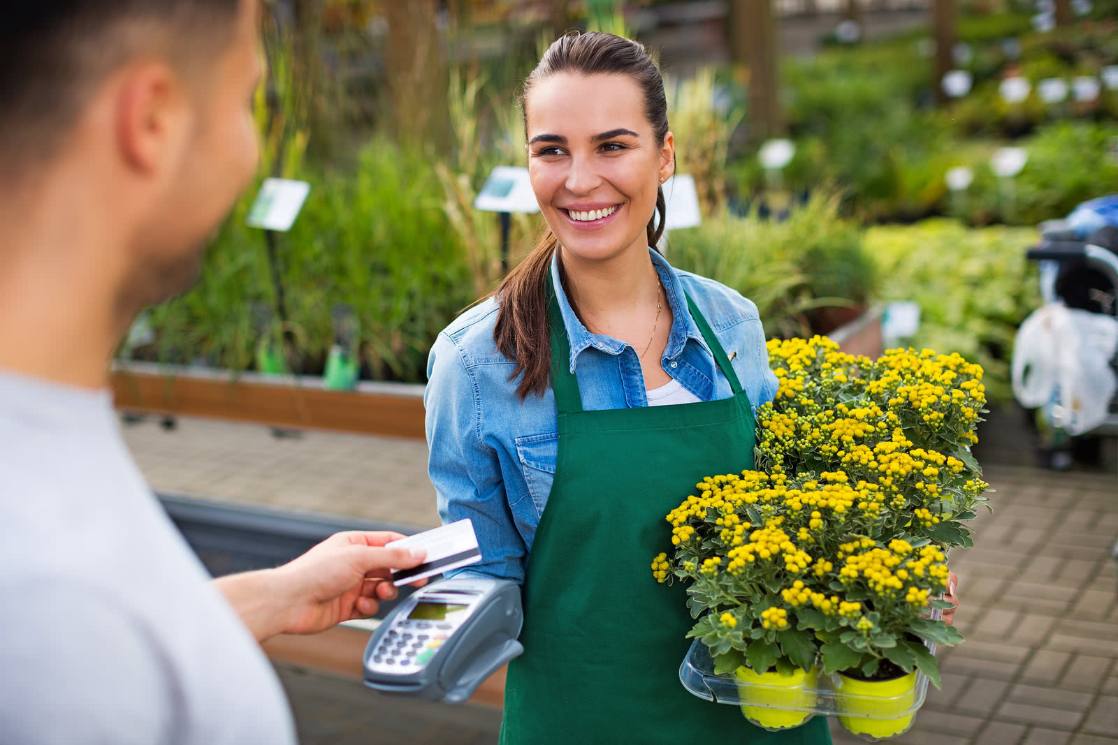 A landscaper buys inventory at a plant nursery with a credit card