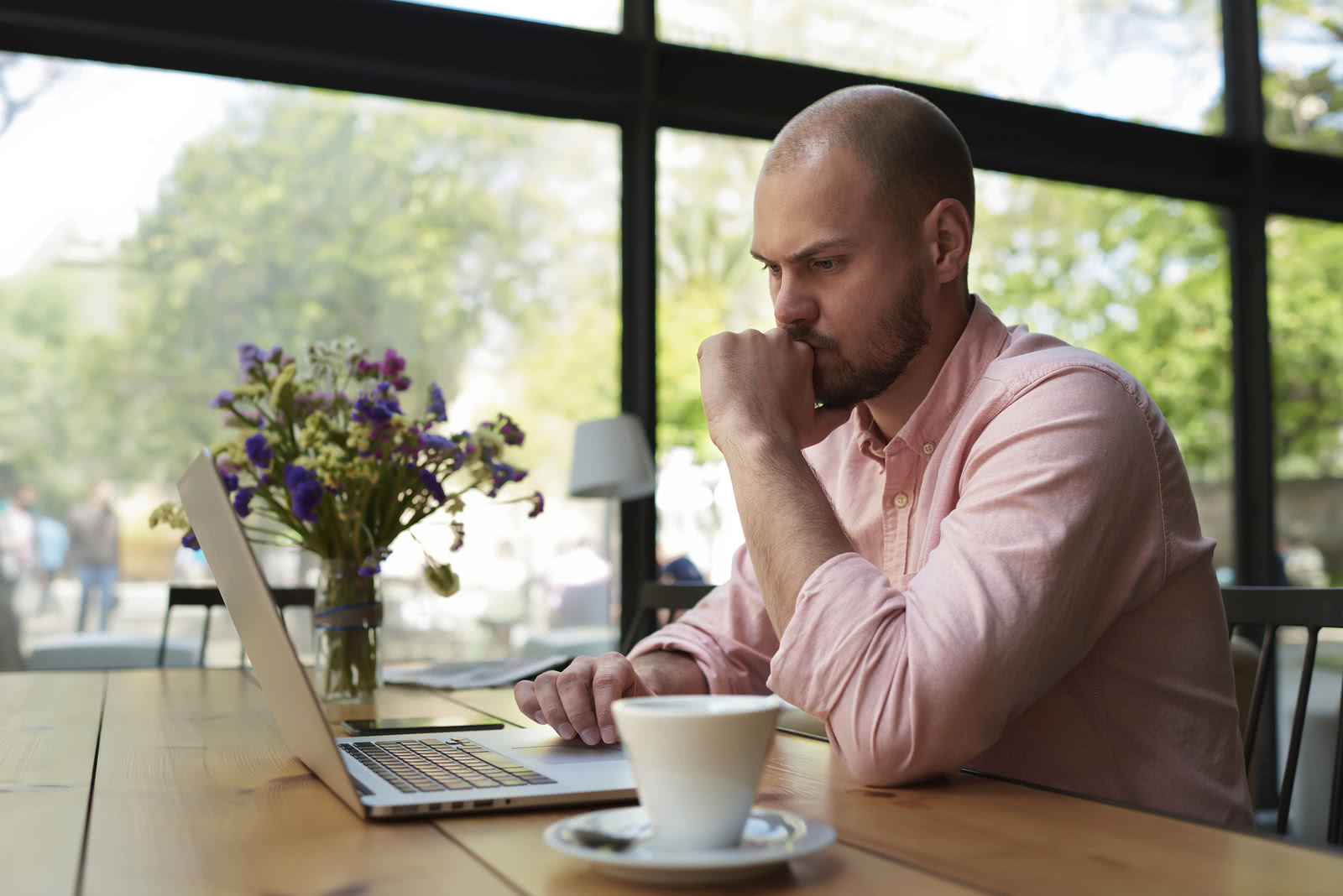 Business owner reviewing financial metrics for small businesses on laptop