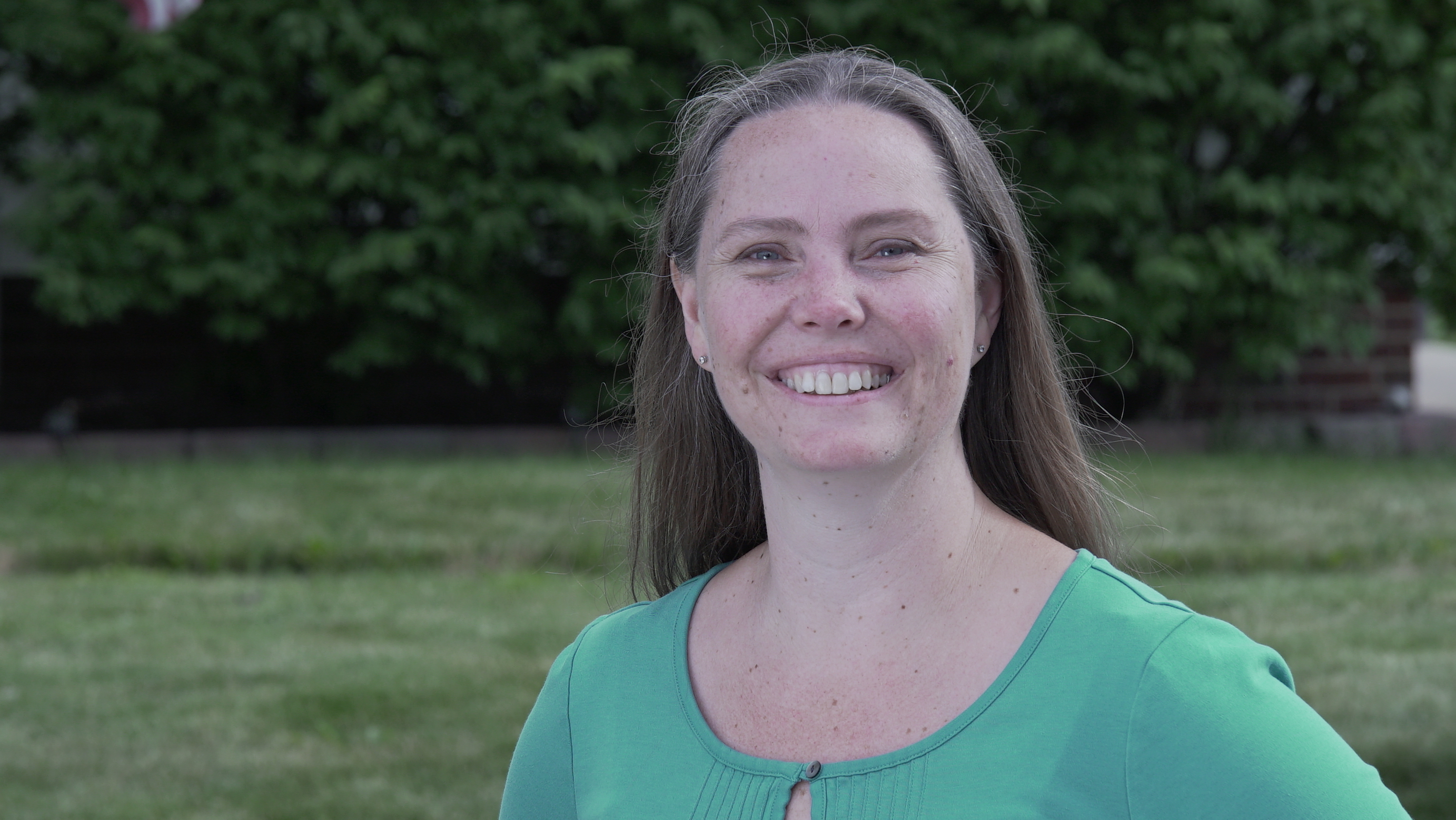 Outside shot of a smiling Cheryl Dailey of Master Handyman