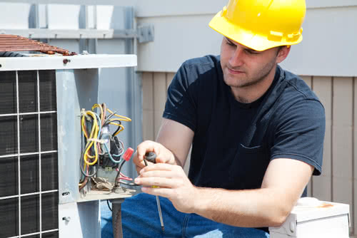 A business owner does maintenance work, a service outlined in his business plan for an HVAC company .