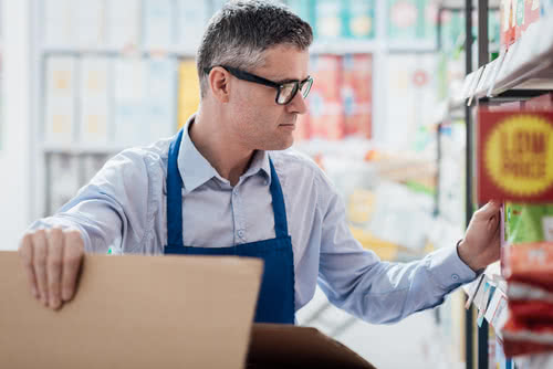 Grocery clerk ponders effects of a minimum wage increase on small businesses