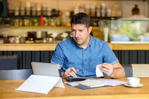 Male restaurant owner learning basic accounting terms