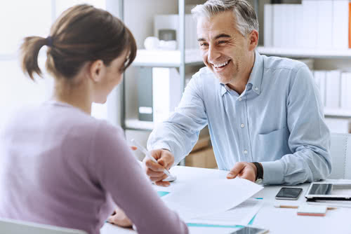 Small business owner meets with consultant to prepare for a recession