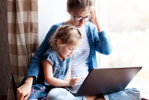 Mother and child use virtual learning technology together